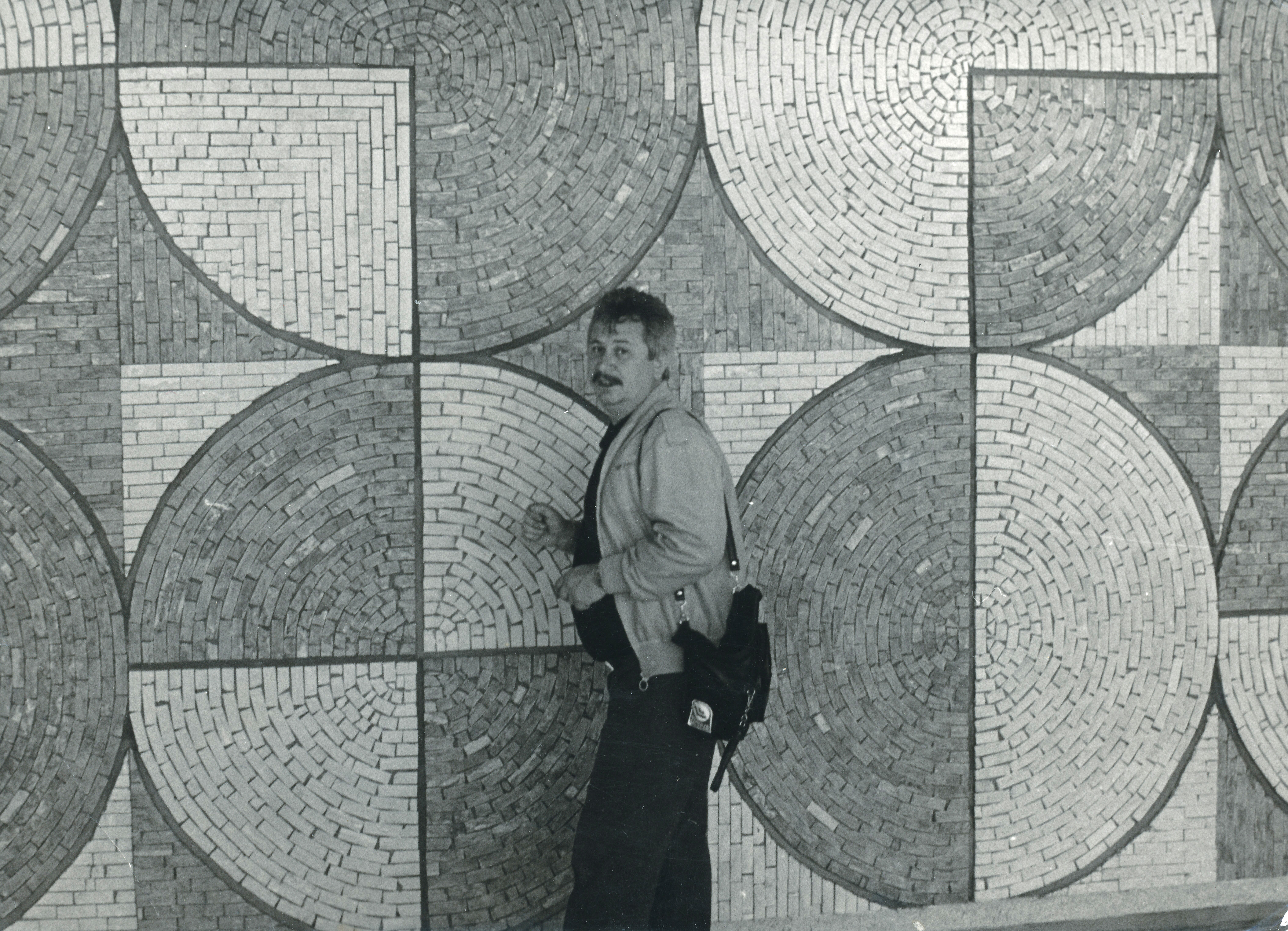 Mosaics author Jan Václavík in front of his work