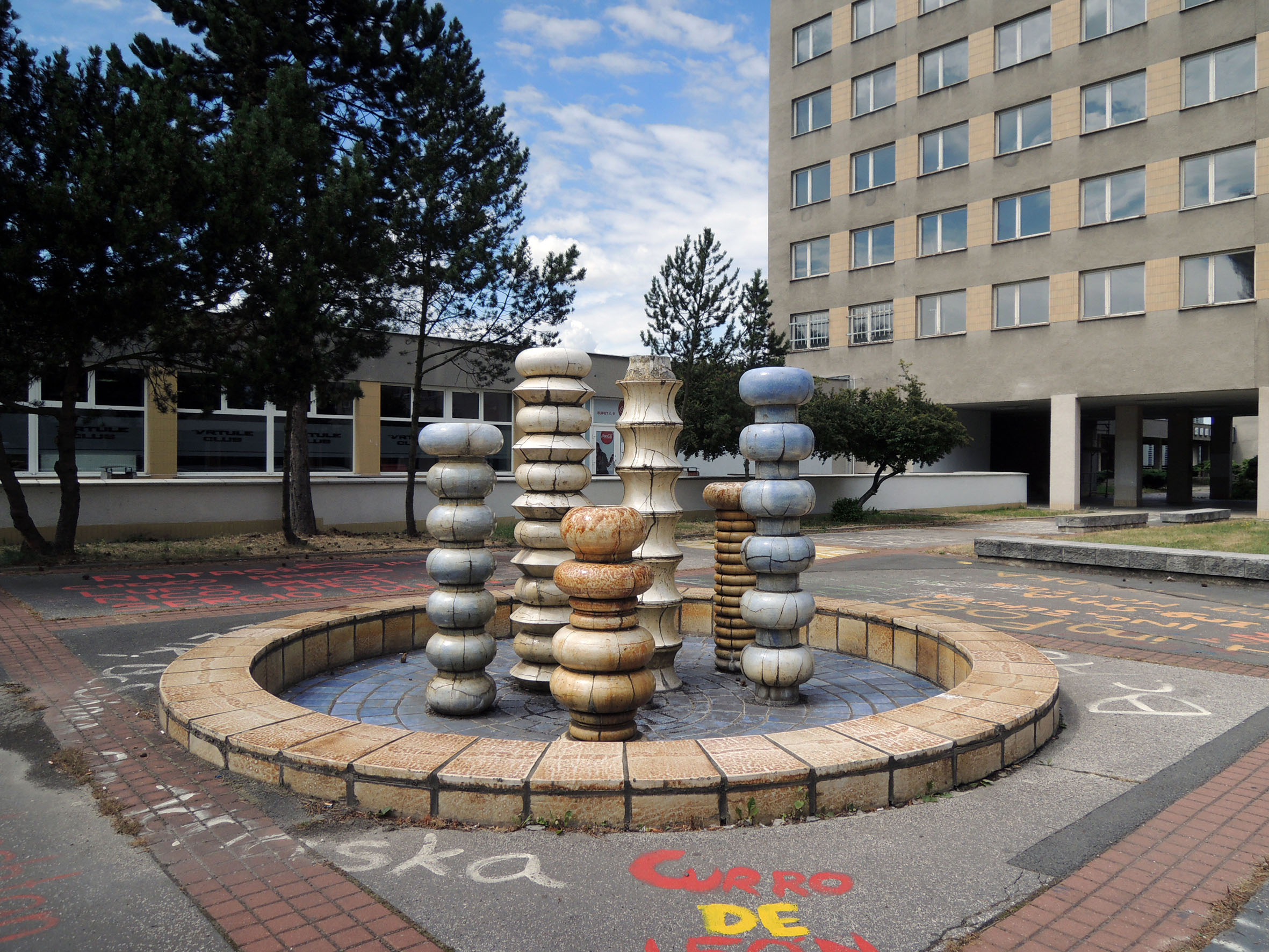 Fountain with background of the building in its original color scheme, 2015, photo by Jakub Ivánek